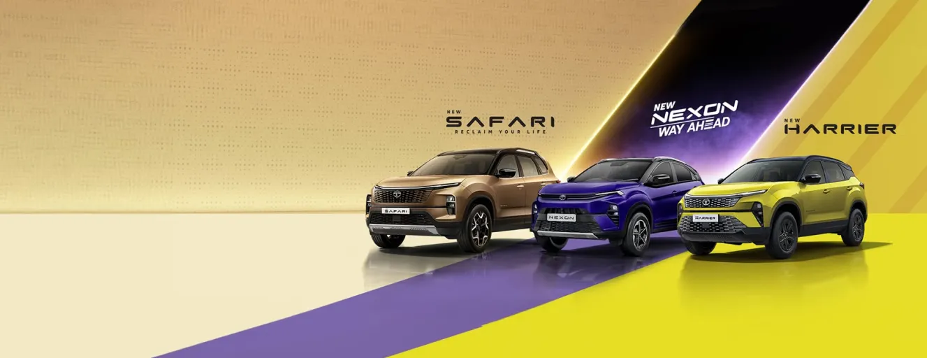 A bronze Tata Safari and a purple Tata Harrier parked on a stylized yellow and purple studio background.
